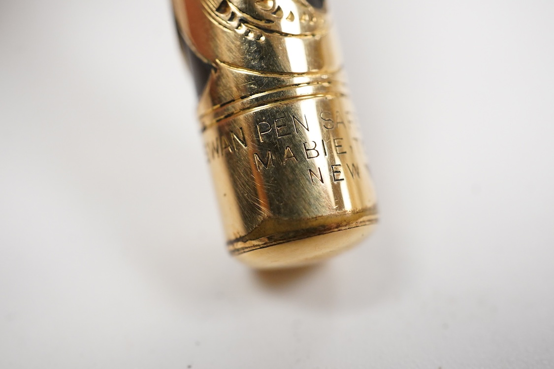 A Swan MT & Co. sterling silver filigree eyedropper along with similar gold filled example